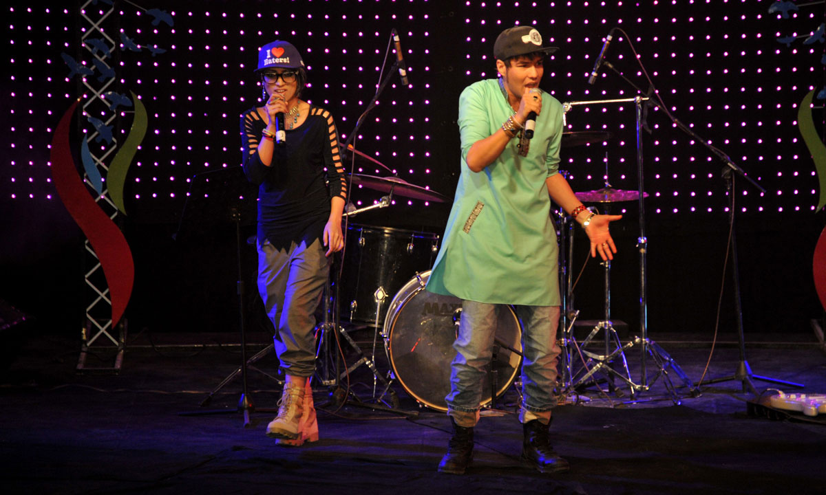 Young Afghan rappers perform during the concert.